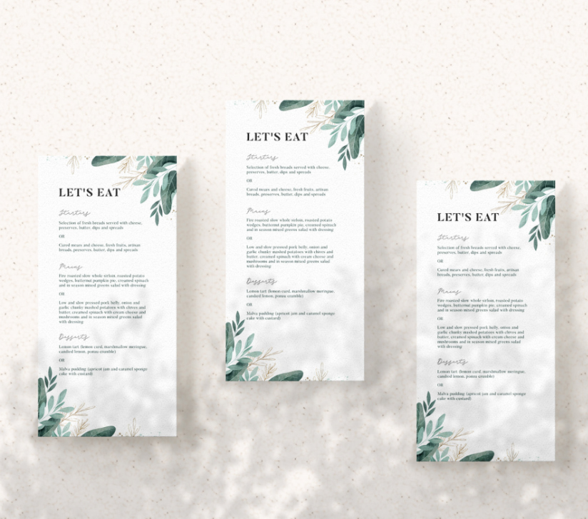 Printed wedding stationery on a light backdrop