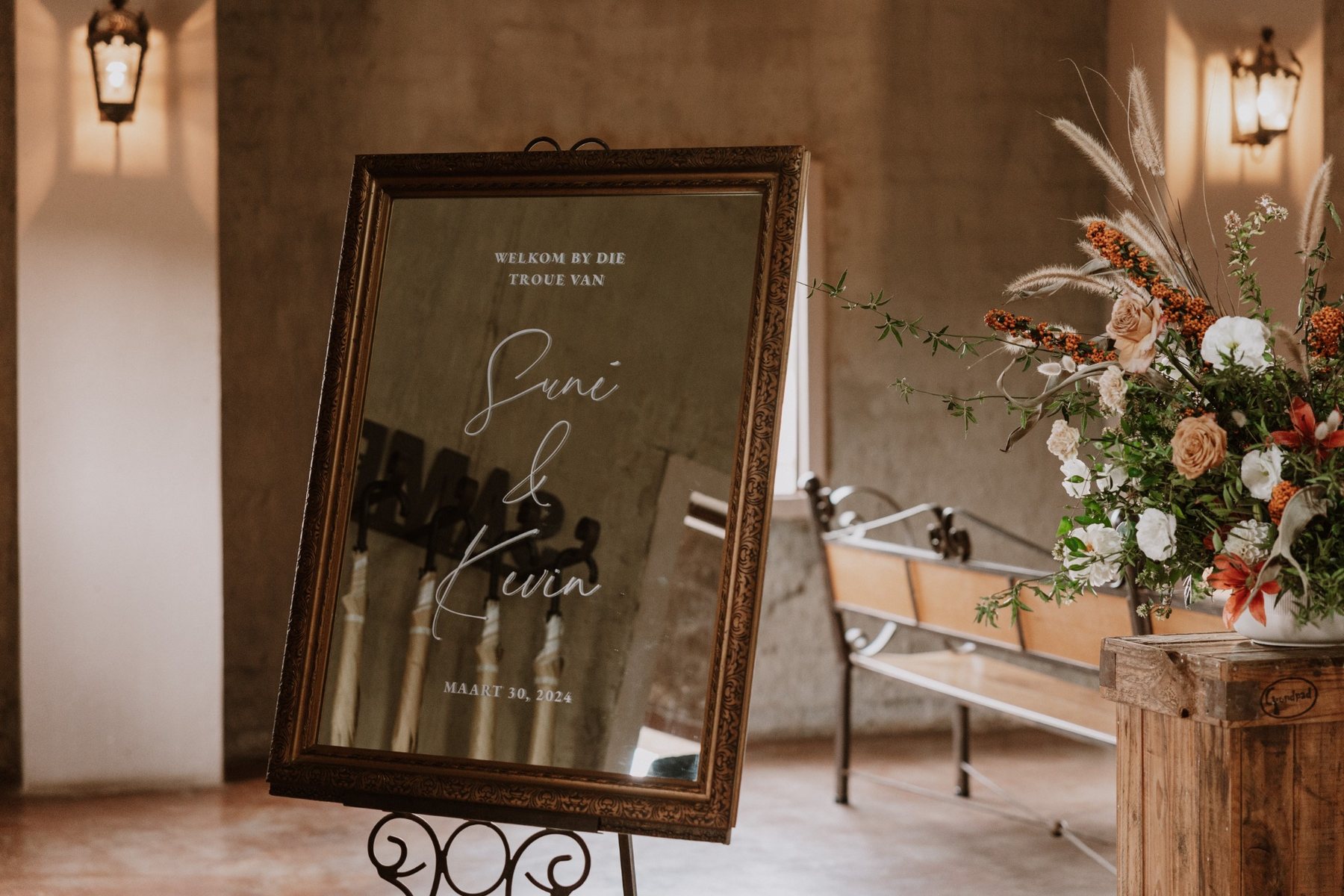 Wedding seating sign on a mirror
